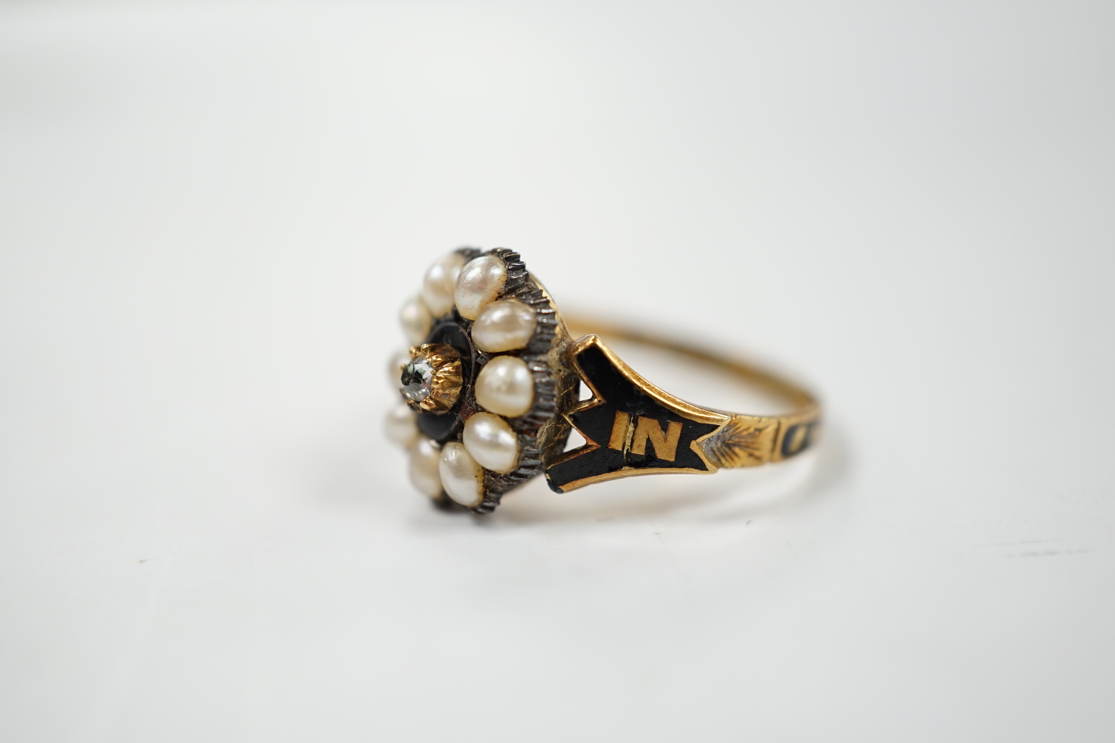 A Victorian 18ct gold, diamond, split pearl and black enamel set mourning ring, size O, gross weight 3.5 grams.